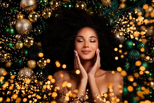 Top flat-lay photo of a stunning woman touching skincare products, showcasing holiday magic and festive sales with a focus on Christmas beauty.